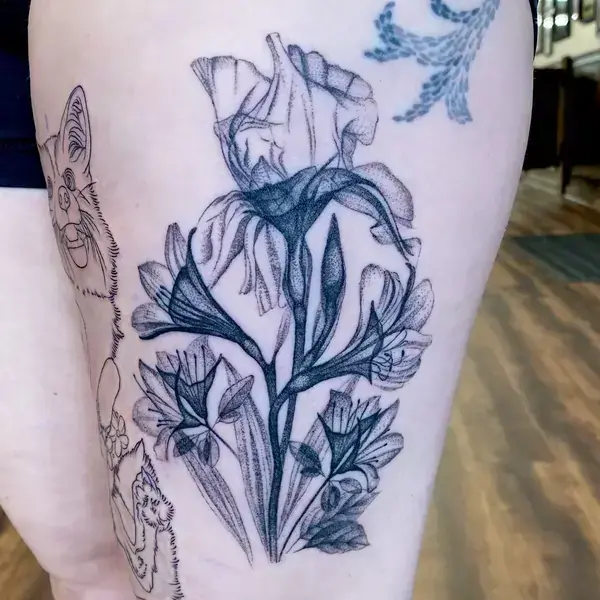 Fine line tattoo of x-ray botanicals including irises with minimalist shading on the thigh by Ruby Gore, fine line tattoo artist portland