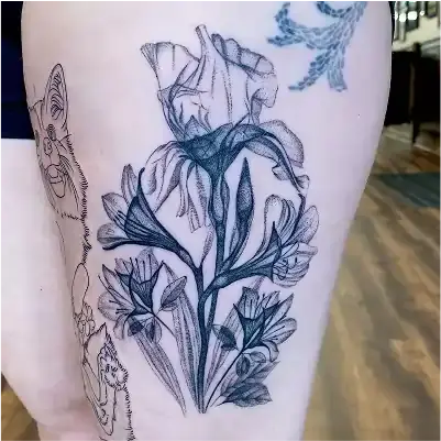 Fine line tattoo of x-ray botanicals including irises with minimalist shading on the thigh by Ruby Gore, nature tattoo artist portland